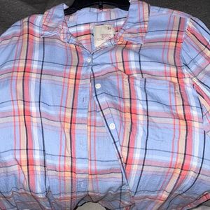 Button Down shirt. Color/pattern blue plaid